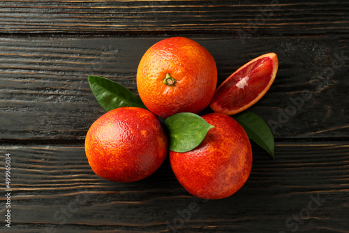 Concept of citrus with red orange on wooden background