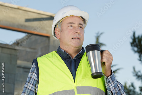 portrait of constructor drinking a coffee on his break