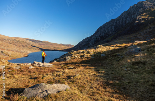 Lake in Snowdonia National Park with female hiker