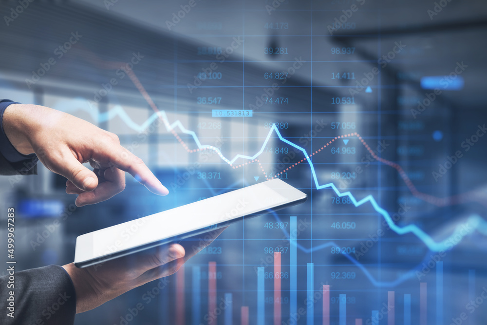 Close up of male hand pointing at tablet with falling downword forex chart on blurry office interior backdrop. Crisis, stock and loss concept. Double exposure. Close up of male hand pointing at tablet with falling downword forex chart on blurry office interior backdrop. Crisis, stock and loss concept. Double exposure.