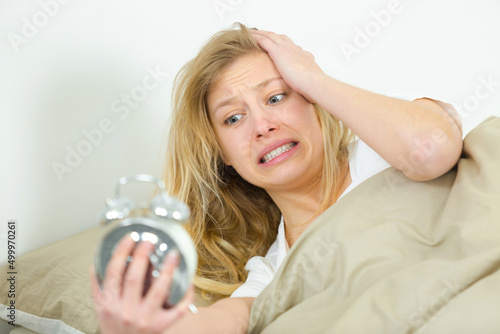 panic woman waking up late in morning photo