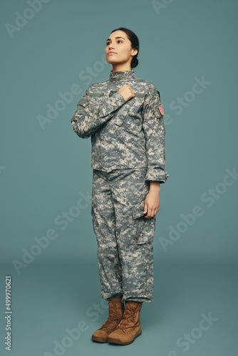 American servicewoman swearing an oath in a studio