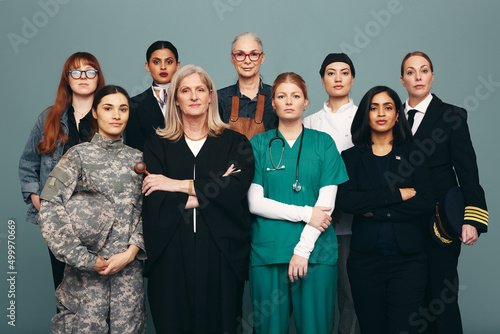 Portrait of different female workers standing in a studio photo