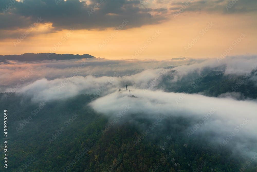 Aerial view fog in the forest and mountains and the transmission towers. Repeater station. Aerial view fog in the forest and mountains and the transmission towers. Repeater station.
