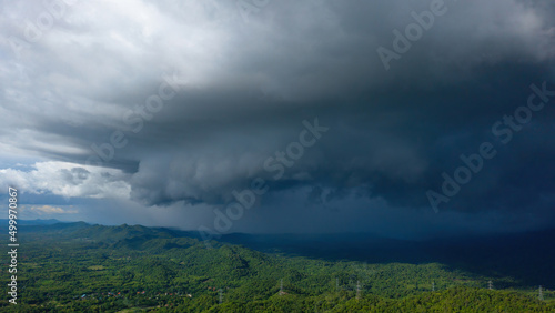 Aerial view rain storms and black clouds moving over the mountains In the north of Thailand, Pang Puai, Mae Moh, Lampang, Thailand.