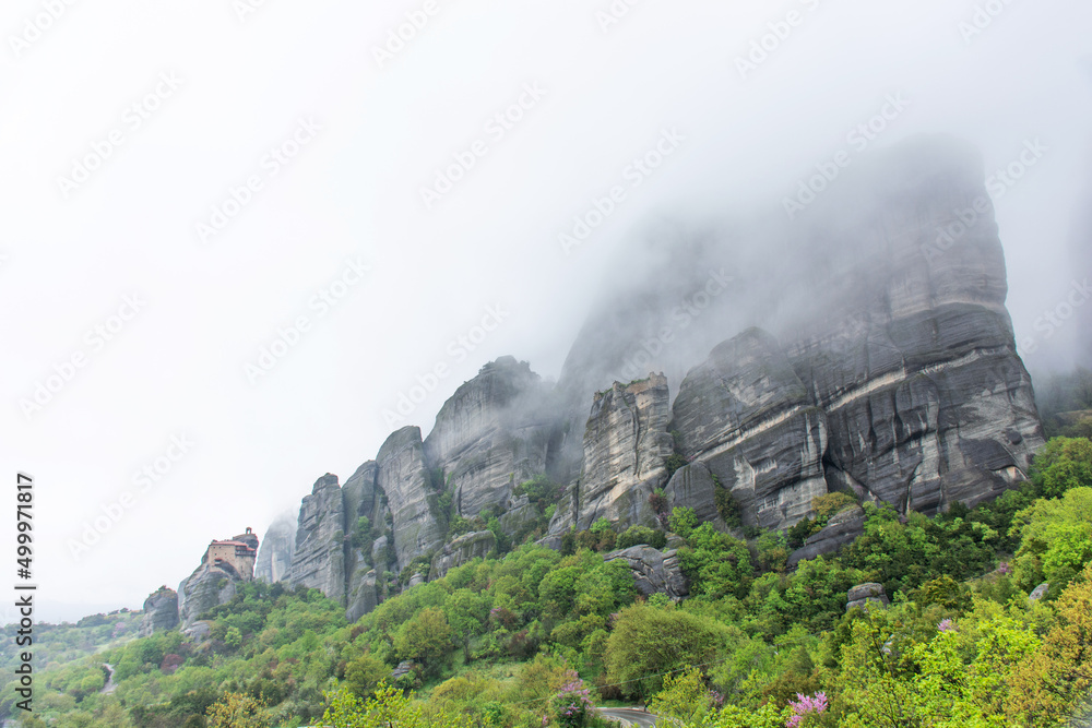 Fototapeta premium Meteora mountains in Greece during rain, cloudy sky