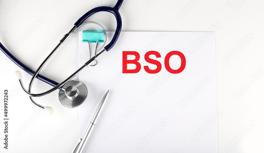 Paper with text BSO on a blue background with stethoscope and pills Paper with text BSO on a blue background with stethoscope and pills