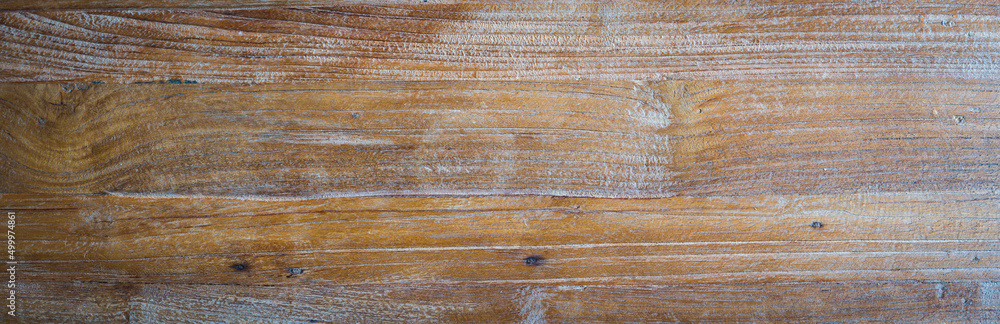 Obraz premium Drewniana podłoga z desek, pięknie wyglądające sęki i przyrosty lekko bielona.