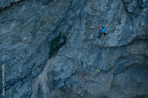 Man climbing on big rock face