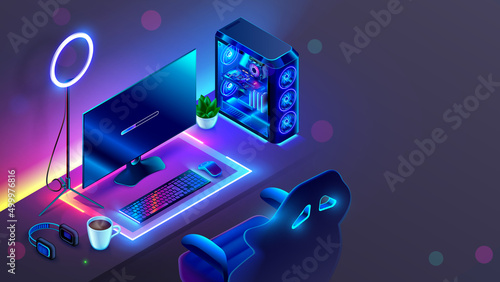 Computer Gaming PC on video gaming desk in dark room with neon light. Futuristic modern workplace of internet blogger, streamer or computer gamer. Monitor, transparent computer, chair, ring light.