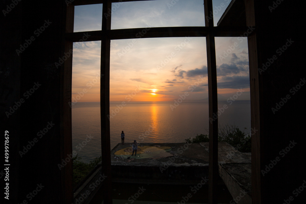 Fototapeta premium Sunset Lombok, Indonesia with framing hose