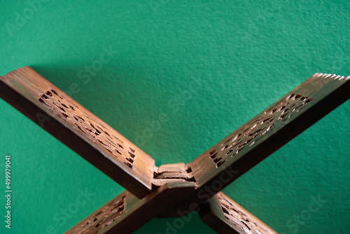  wooden book stand against green background