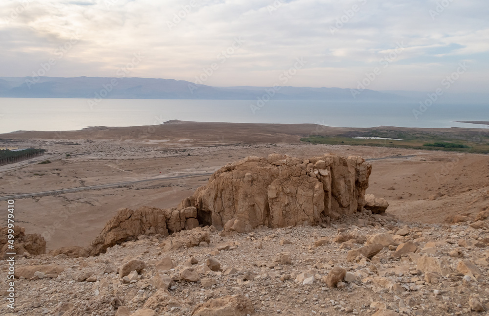 View  from a mountain near the Tamarim stream on the Israeli side of the Dead Sea at sunrise over the Dead Sea and over the mountains on the Jordan side near Jerusalem in Israel