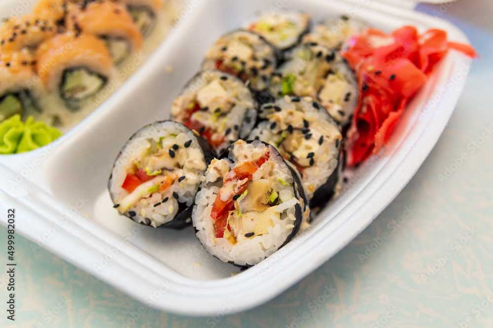 sushi from delivery in a disposable container sushi from delivery in a disposable container