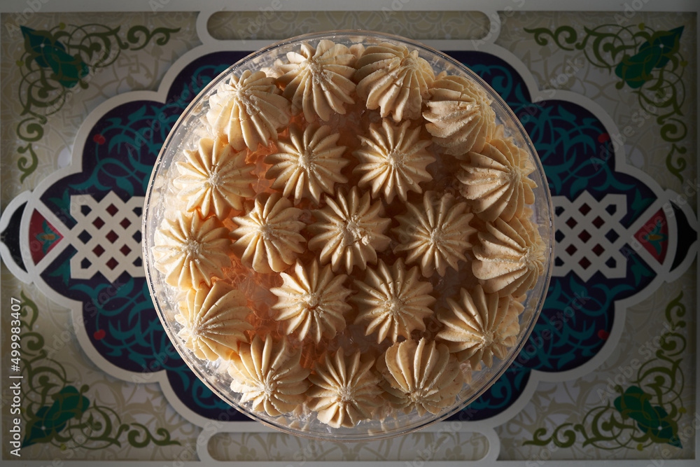 ramadan cookie against against arabic design food tray