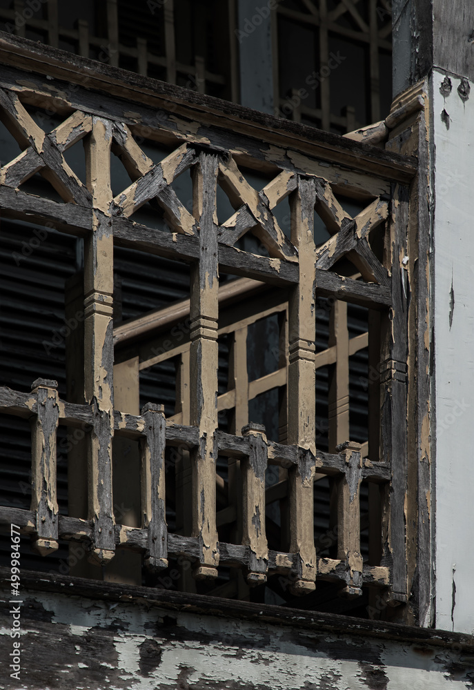 Traditional old wooden railings decorative pattern at old wooden house was left to deteriorate over time. No focus, specifically. Traditional old wooden railings decorative pattern at old wooden house was left to deteriorate over time. No focus, specifically.