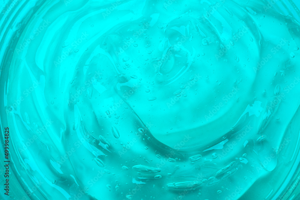 Texture of blue transparent cosmetic moisturizing gel, top view as background or overlay Texture of blue transparent cosmetic moisturizing gel, top view as background or overlay