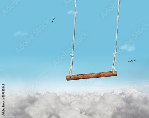 Swing bar swinging over blue sky with clouds foam