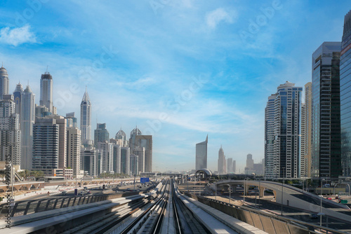 Dubai metro railway in downtown district with buildings and skyscrapers. United Arab Emirates. Panoramic view