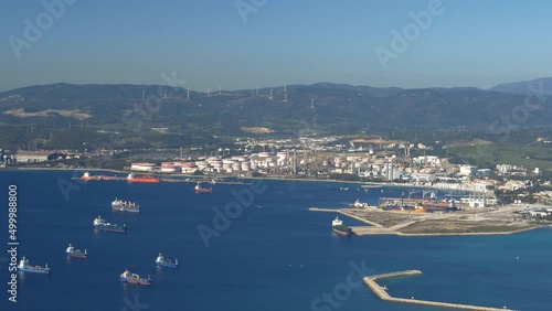Ships anchored off Gibraltar waiting to dock or depart. Wide