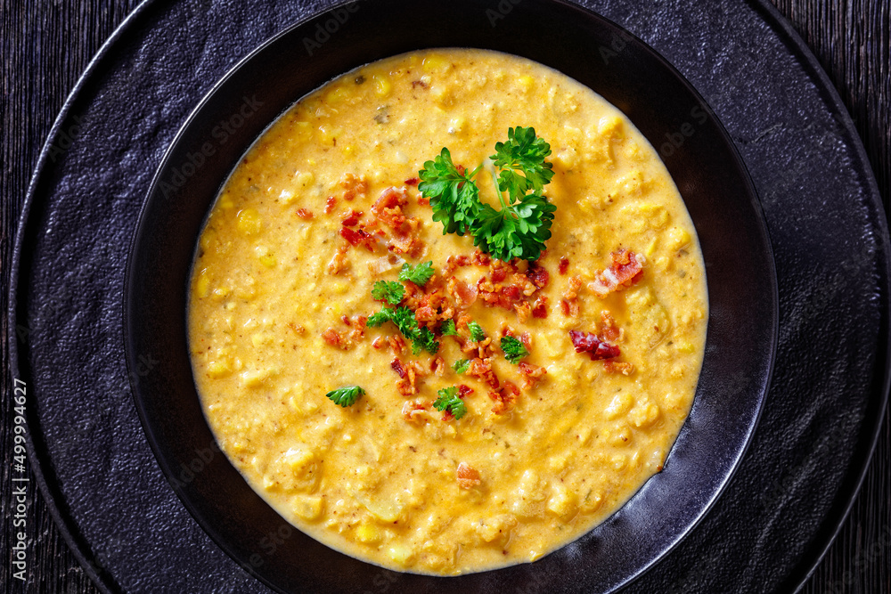 corn chowder in bowl on table, top view corn chowder in bowl on table, top view