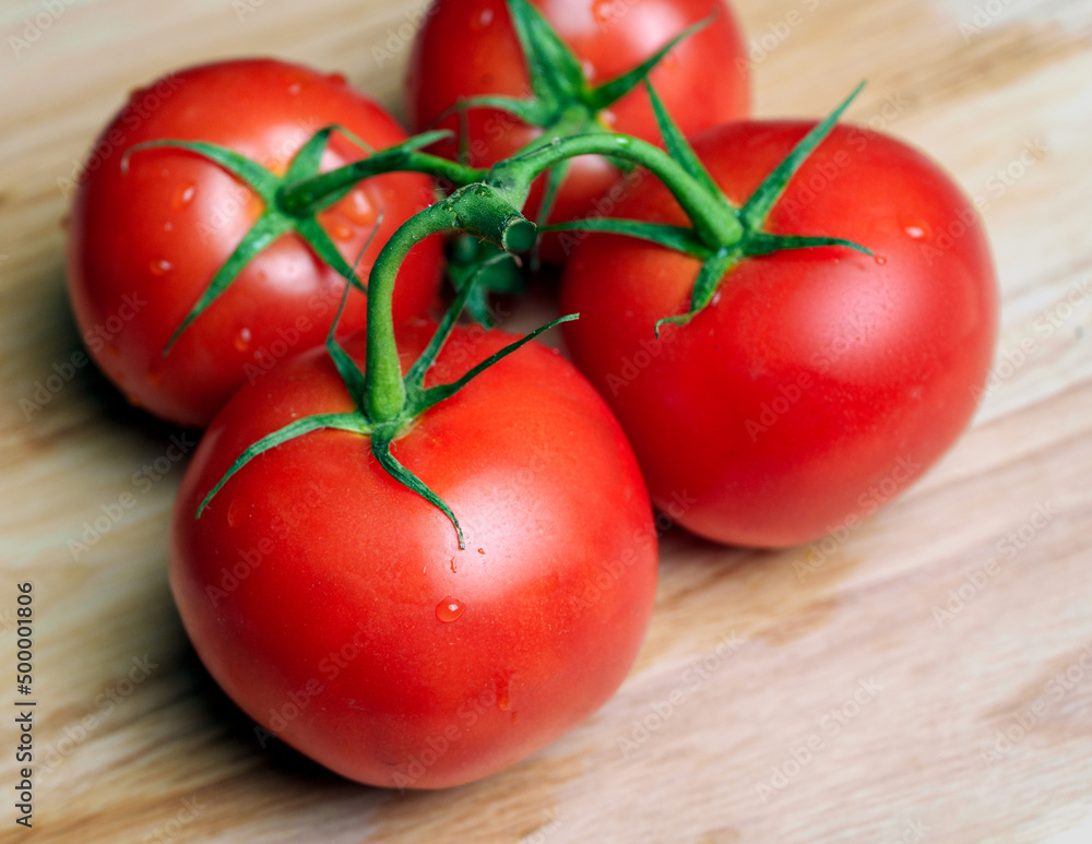 Vine Tomato on Cutting Board Vine Tomato on Cutting Board