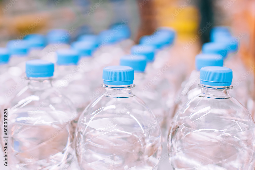 Close-up, bottles of mineral water in a supermarket. Close-up, bottles of mineral water in a supermarket.
