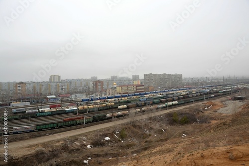 Railway tracks of the Zhiguli Sea station on the background of buildings of the Tolyatti city district