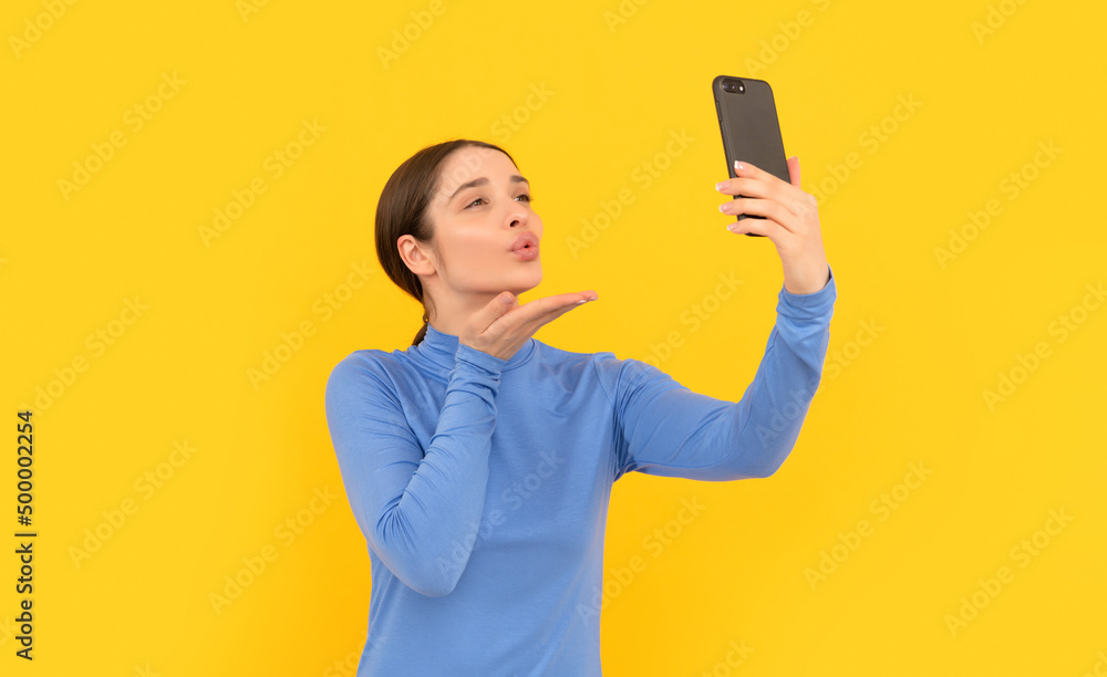 woman blogger use smartphone. video call online. vlog with mobile phone. kiss. woman blogger use smartphone. video call online. vlog with mobile phone. kiss.