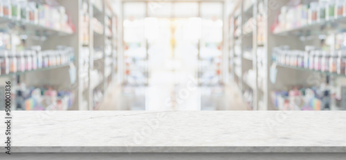 Canvas Print Empty white marble counter top with blur pharmacy drugstore shelves background