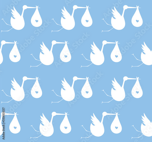 Seamless pattern with white storks on a blue background with baby boys. Suitable for wallpaper, wrapping or textile.