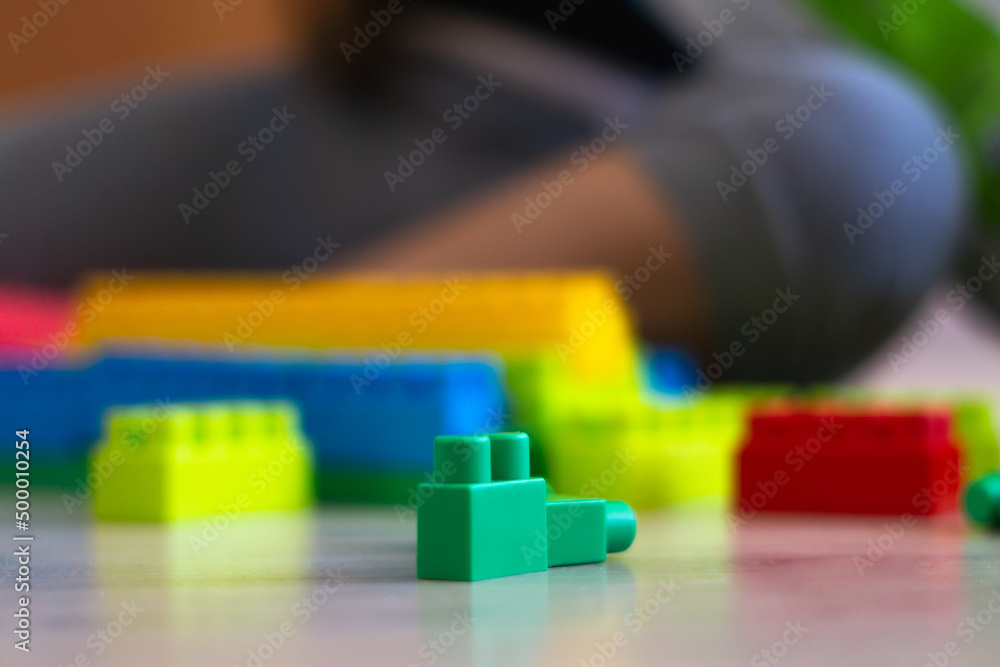 little girl playing with toys at home, Brickss type toys