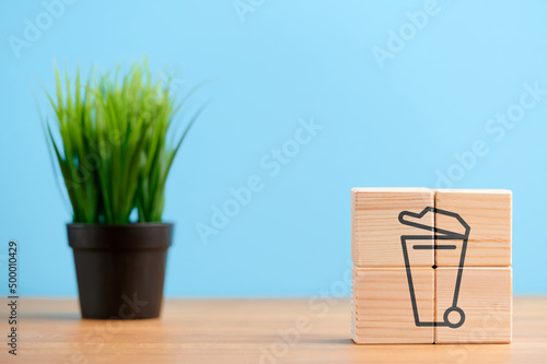Ecology concept, wooden blocks with icon of ecology trash environment eco icon, on blue background