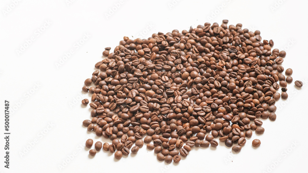 roasted coffee beans on a white background roasted coffee beans on a white background