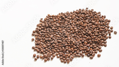 roasted coffee beans on a white background © Alla