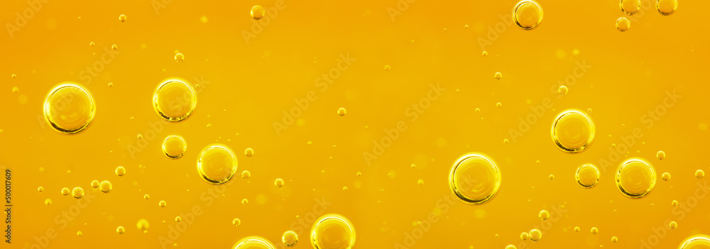 Golden liquid with air or oxygen bubbles on oil background  for projects, oil, honey, beer, juice, shampoos. Oil background.
