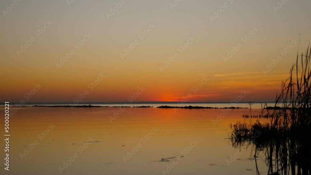 Scenic landscape of the beach and red sunset Scenic landscape of the beach and red sunset