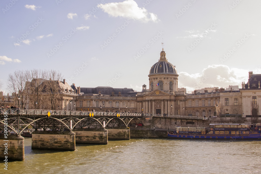 View of Institut de France and Pont des Arts over the Seine in Paris, France