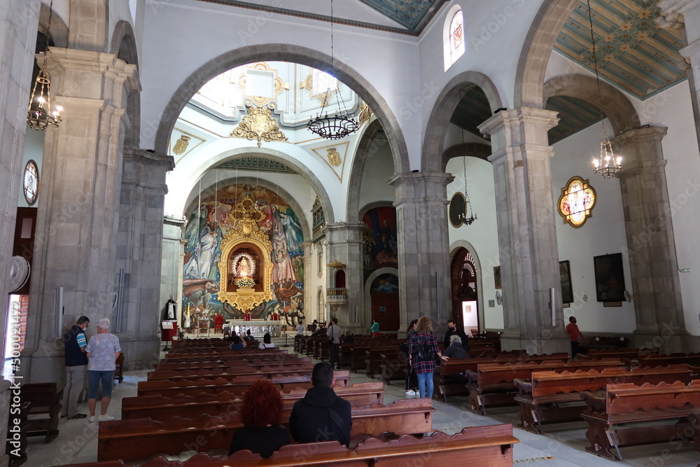 Candelaria, Tenerife, Canary Islands, Spain, March 8, 2022: Faithful in the main hall of the Basilica of Candelaria in Tenerife. Spain