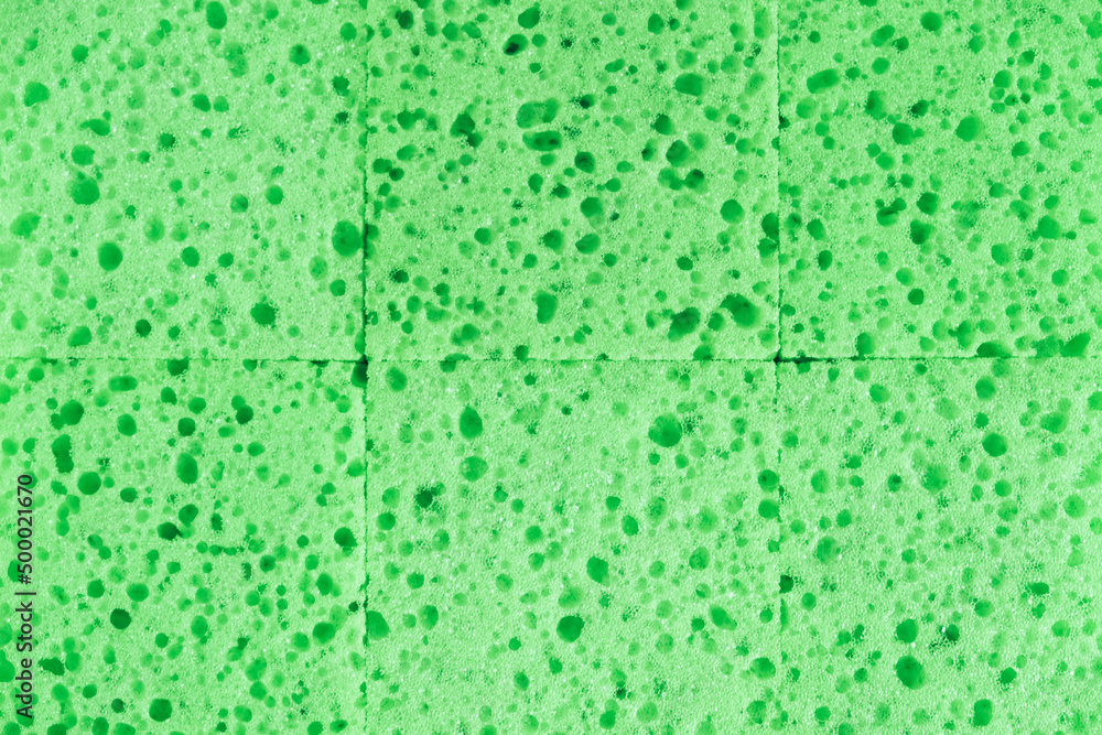 Green sponges for cleaning as a background texture Green sponges for cleaning as a background texture