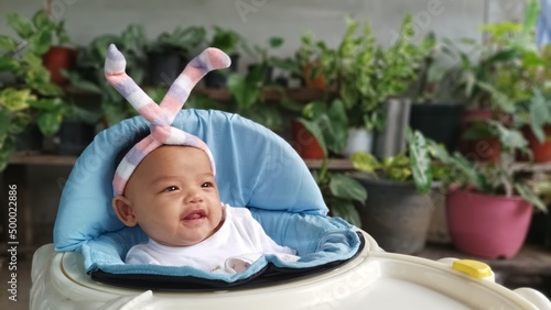 Asian happy baby smiling with copy space. Cute 4 months baby.