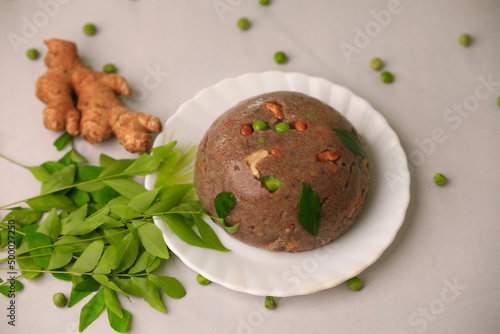 Raagi upma,multi millet upma south indian famous breakfast closeup with selective focus and blur photo