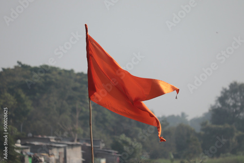 Schilderij op canvas Orange flag with blurred background
