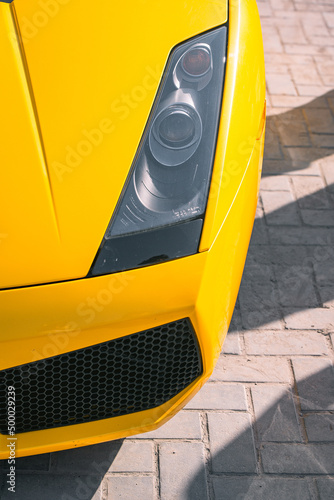 Fotografie, Obraz Top view of yellow Lamborghini Gallardo with headlights
