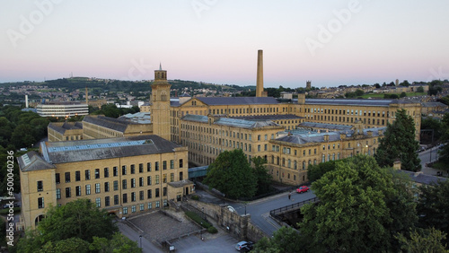 Aerial shot of cityscape Saltaire with Salts Mill building in daylight photo