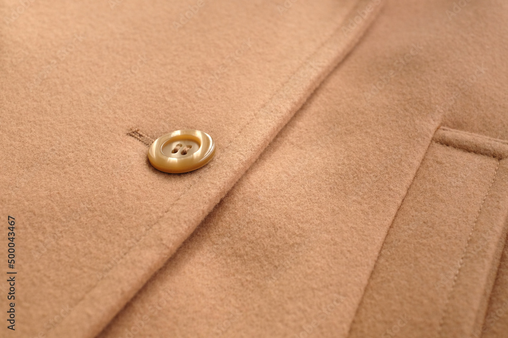 Details of a fabric woolen jacket, close-up, abstract fashion background Details of a fabric woolen jacket, close-up, abstract fashion background