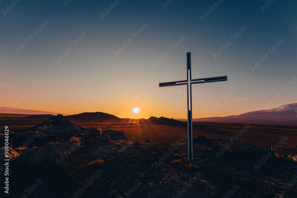 Cross with a colorful sunset.