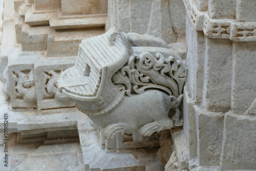 Closeup of an intricate sculpted animal figure in the Ranakpur Jain temple in India photo