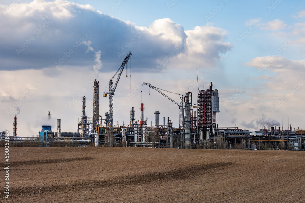 panorama of industrial landscape environmental pollution waste of thermal power plant. Big pipes of chemical industry enterprise plant