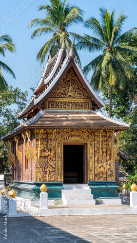 Vertical shot of Wat Sensoukharam Buddhist temple in Luang Prabang, Laos photo